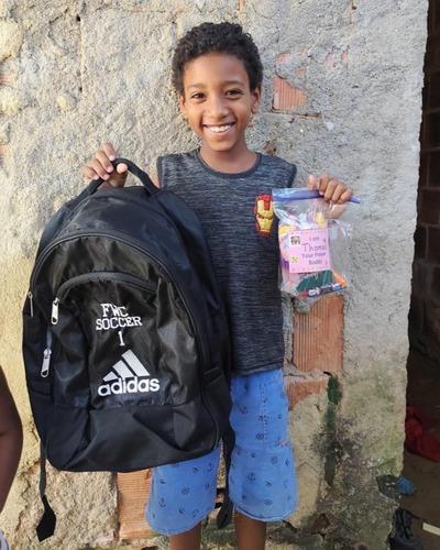 Happy boy smiling widely after receiving a gift