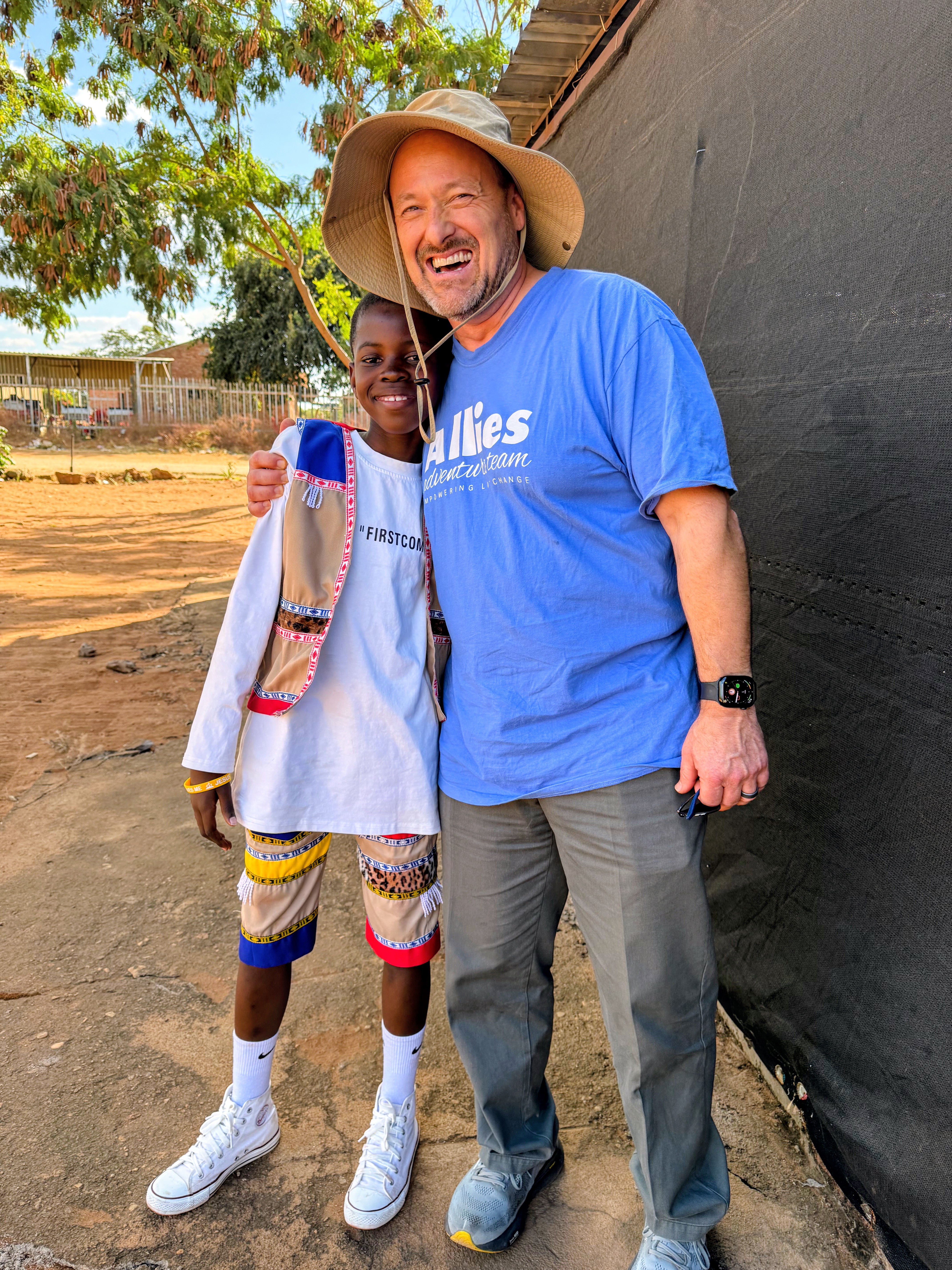 Pastor Jon with a child during an Allies Adventure Trip