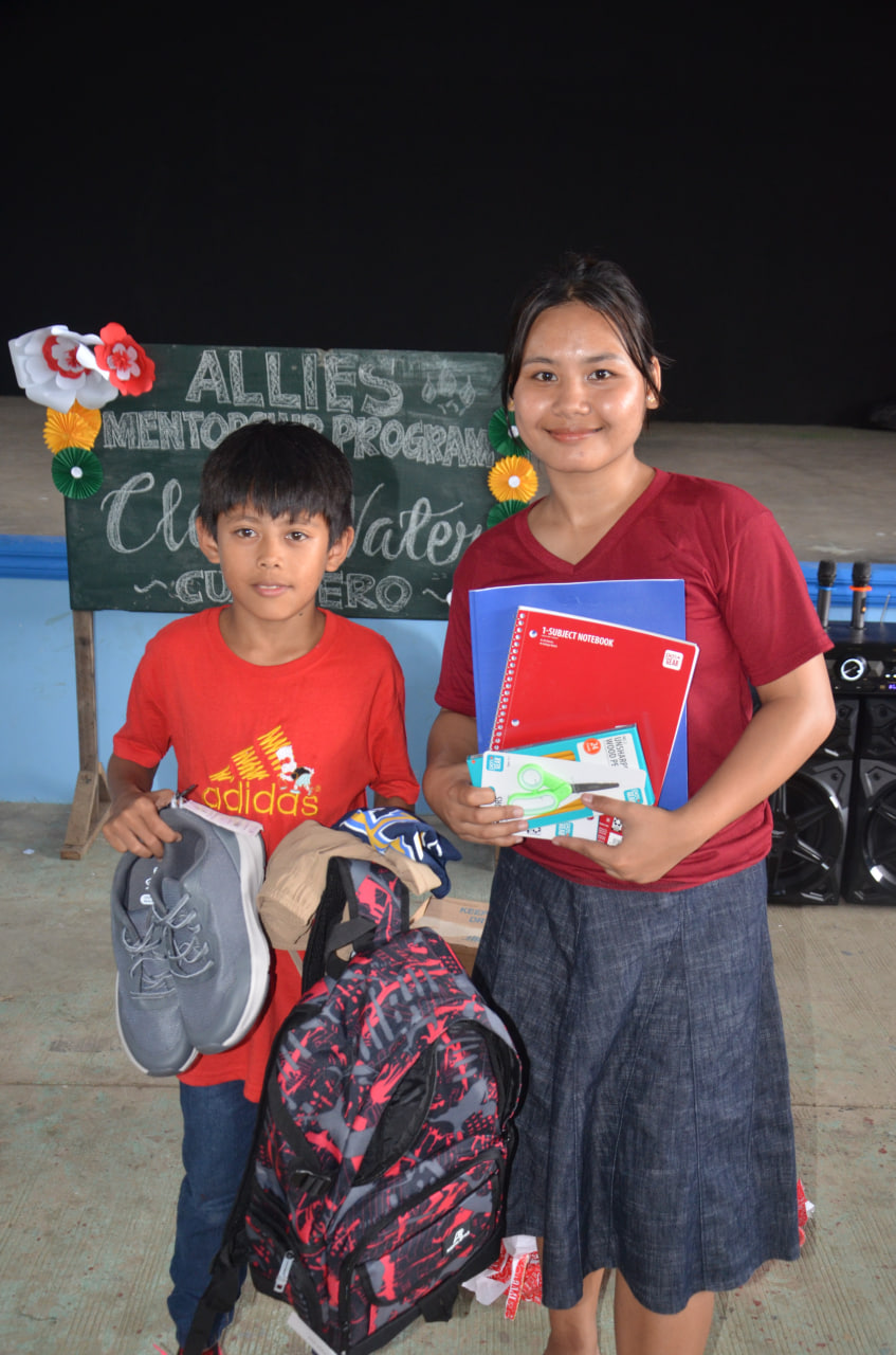 Children receiving school supplies