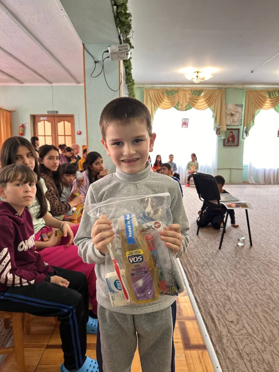 Boy receiving hygiene supplies