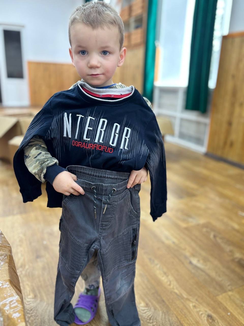 Boy receiving clothing aid