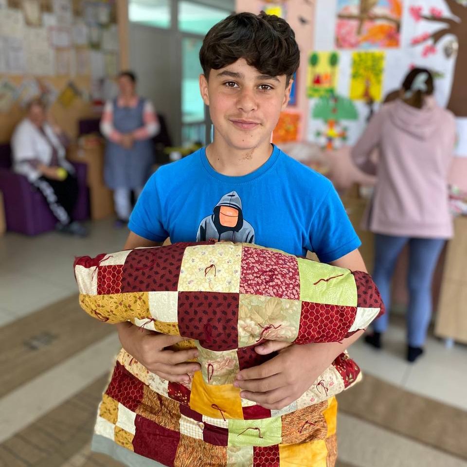 Child with quilt