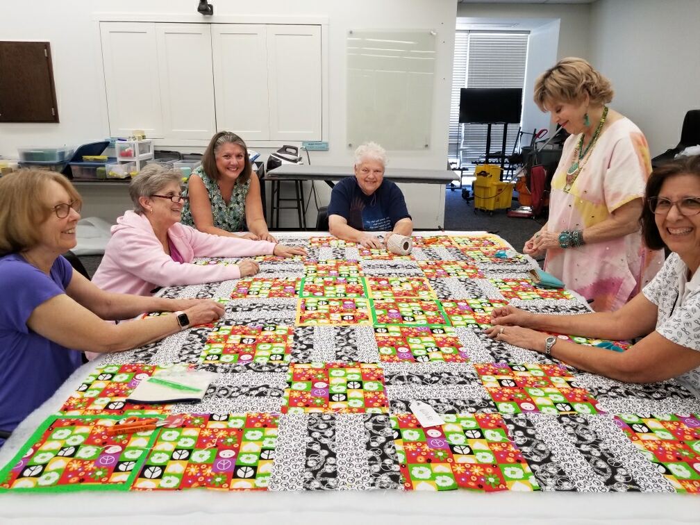 Volunteers quilting
